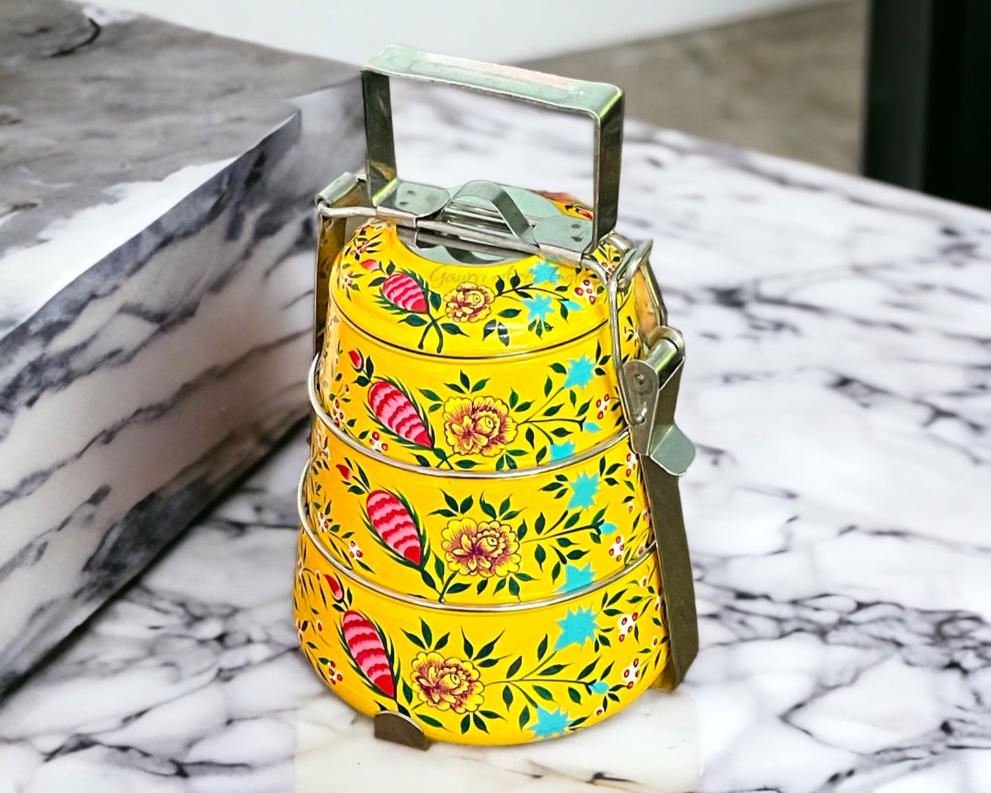 Hand-painted stainless steel tiffin carrier combines durability with artistic charm, making it a thoughtful gift for family or friends