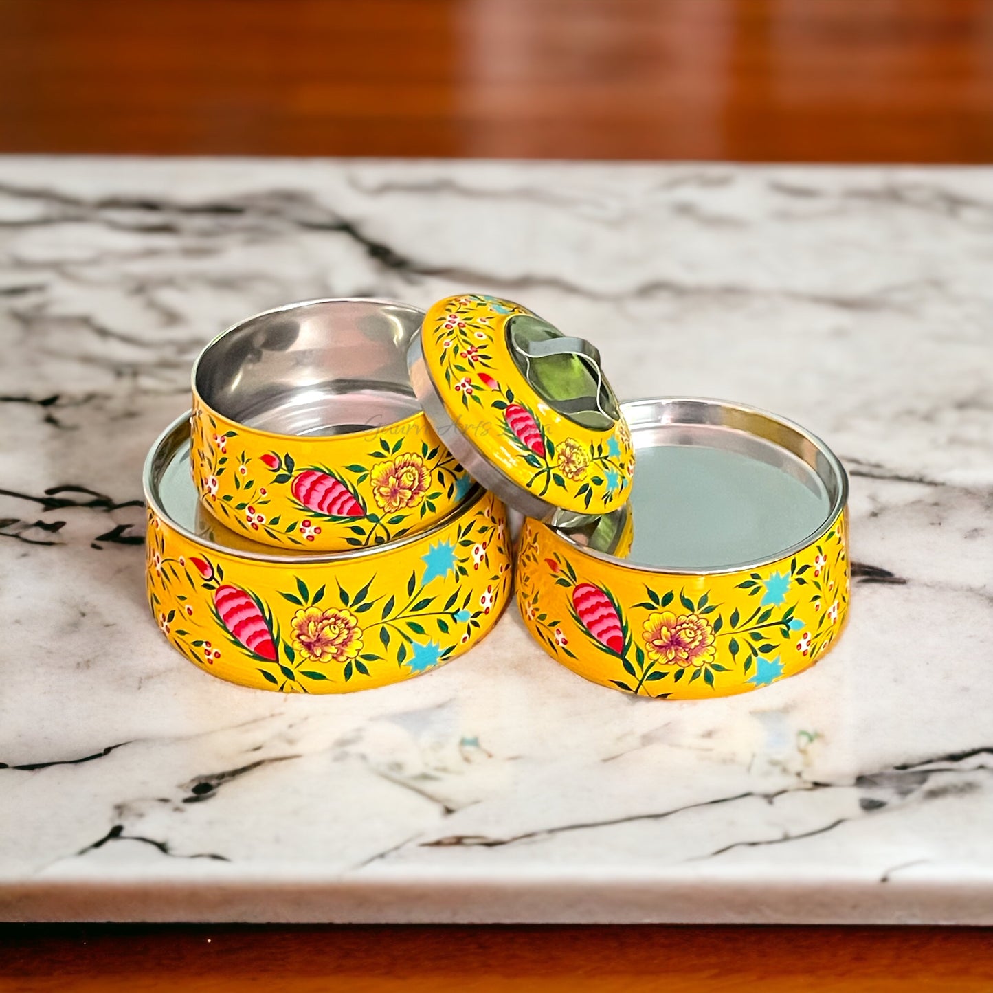 Hand-painted stainless steel tiffin carrier combines durability with artistic charm, making it a thoughtful gift for family or friends