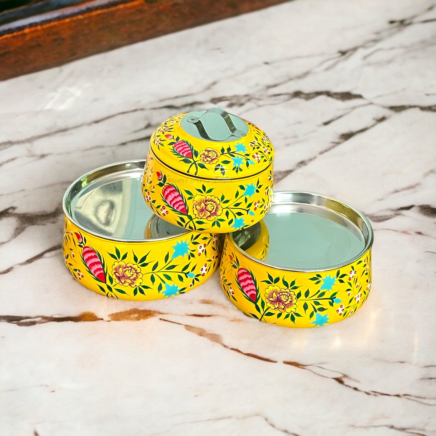 Hand-painted stainless steel tiffin carrier combines durability with artistic charm, making it a thoughtful gift for family or friends
