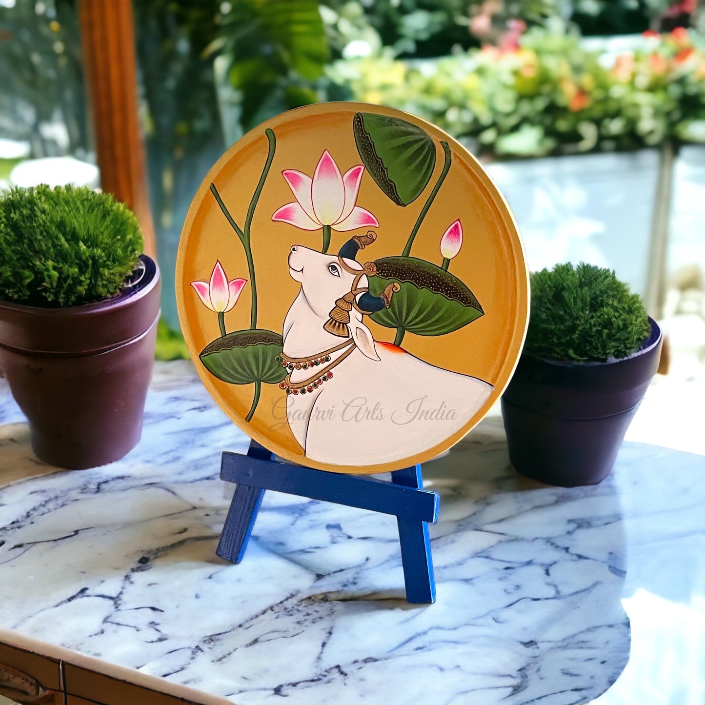 Enhance your home decor with this exquisite Pichwai Hanging Wall Plate. Crafted with traditional artistry, it brings a touch of cultural elegance and vibrant charm to any space.