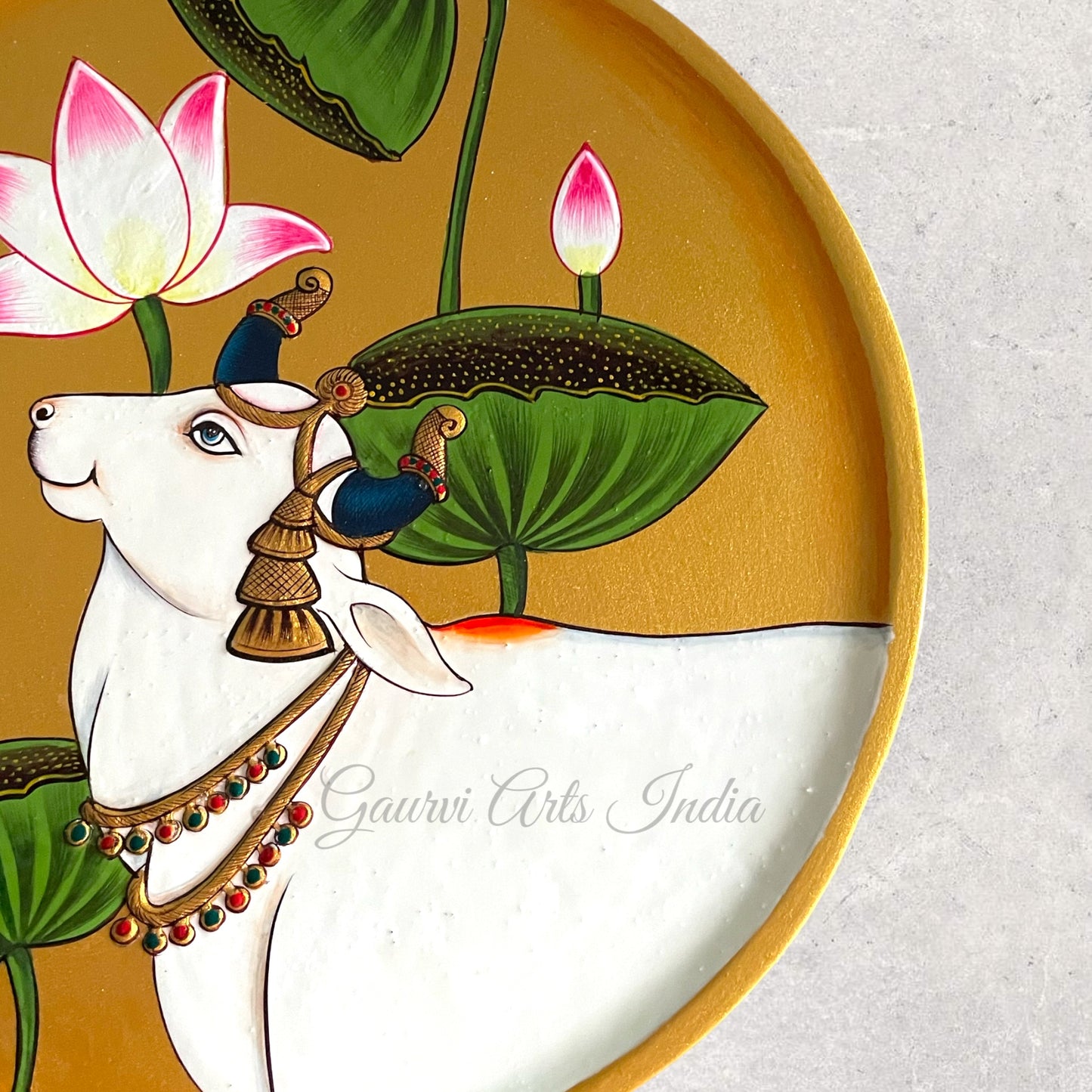 Enhance your home decor with this exquisite Pichwai Hanging Wall Plate. Crafted with traditional artistry, it brings a touch of cultural elegance and vibrant charm to any space.