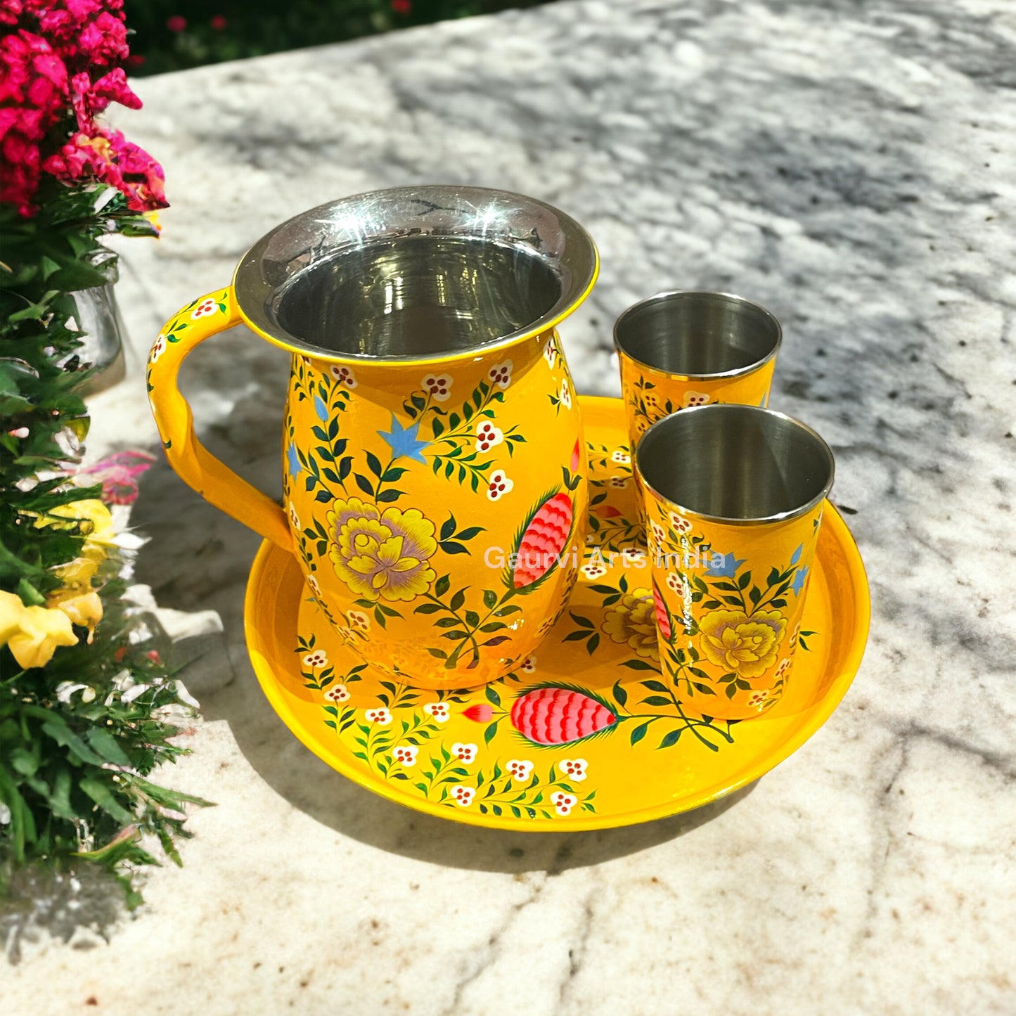 Stainless steel pitcher set includes a sleek pitcher, matching tumblers, and a round tray, designed for everyday use.