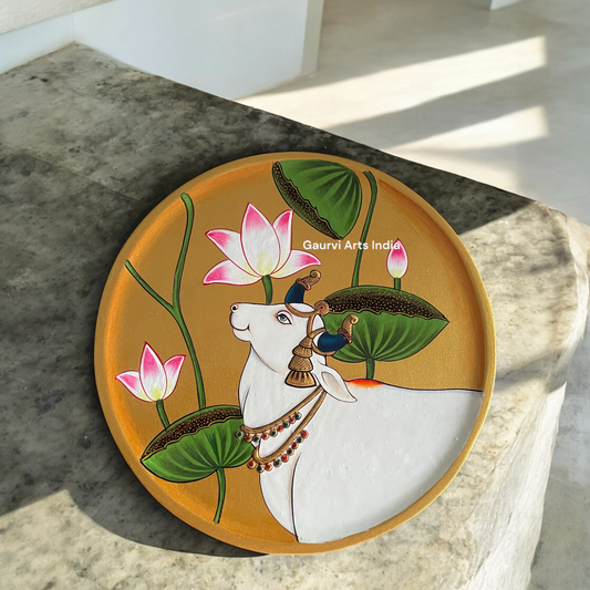 Enhance your home decor with this exquisite Pichwai Hanging Wall Plate. Crafted with traditional artistry, it brings a touch of cultural elegance and vibrant charm to any space.