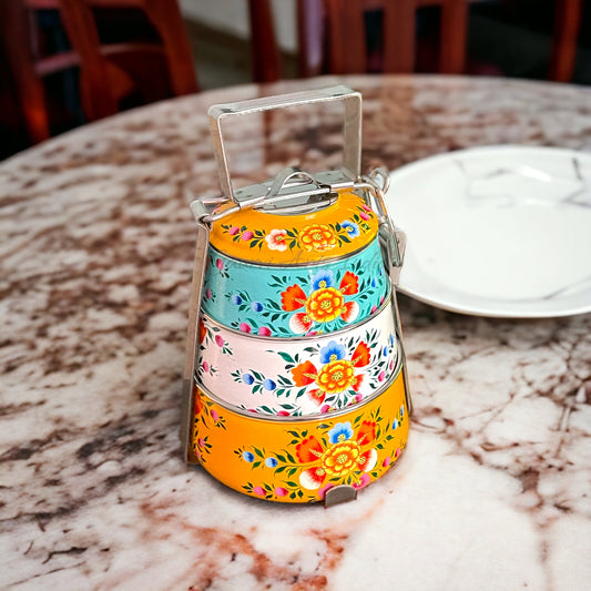 Hand-painted stainless steel tiffin carrier combines durability with artistic charm, making it a thoughtful gift for family or friends
