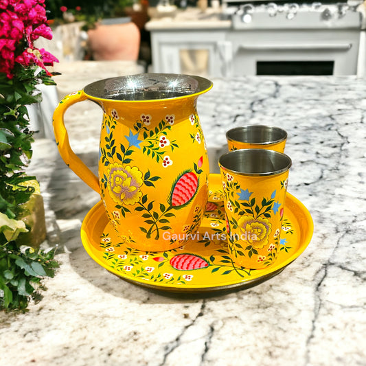 Stainless steel pitcher set includes a sleek pitcher, matching tumblers, and a round tray, designed for everyday use.